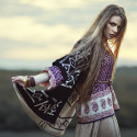 Beautiful hippie girl outdoors at sunset. Boho fashion style