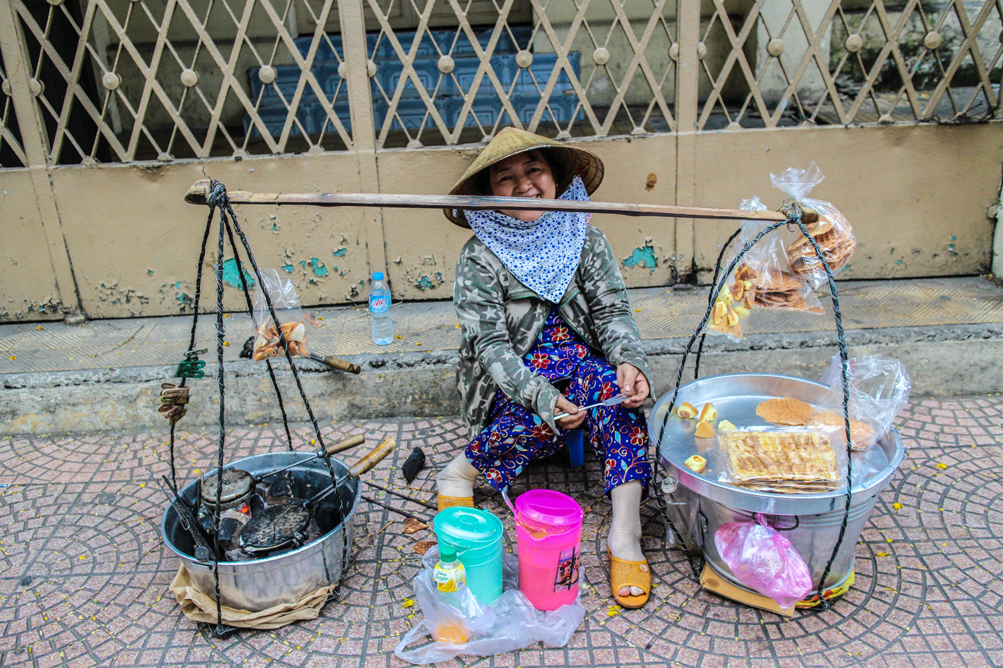 Vietnamese street vendor selling warm waffles