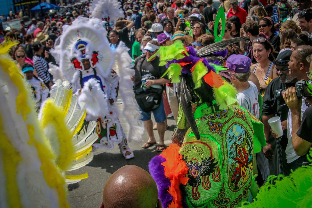 Dow Edwards of the Mohawk Hunters tribe, participating in a 'Spy Boy Standoff' on Super Sunday in New Orleans. Photo by Bret Love and Mary Gabbett, courtesy of Green Global Travel[http://greenglobaltravel.com/2015/12/06/treme-new-orleans-birthplace-of-american-culture/].