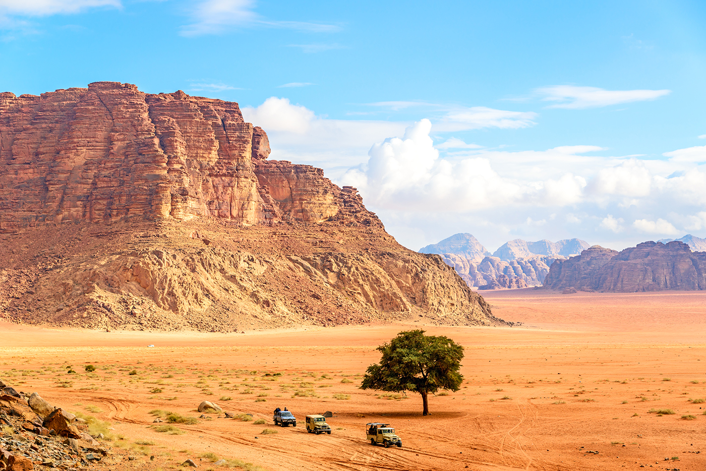 Jordanian desert in Wadi Rum, Jordan viewed from Lawrence's Spring. Wadi Rum is known as The Valley of the Moon and has led to its designation as a UNESCO World Heritage Site.