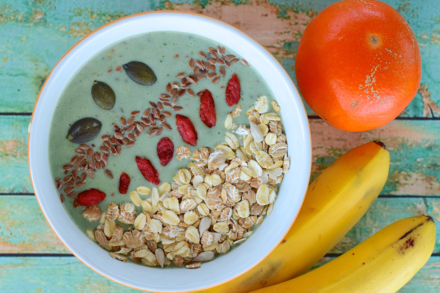 Green spirulina bowl with oats, goji berries, and 