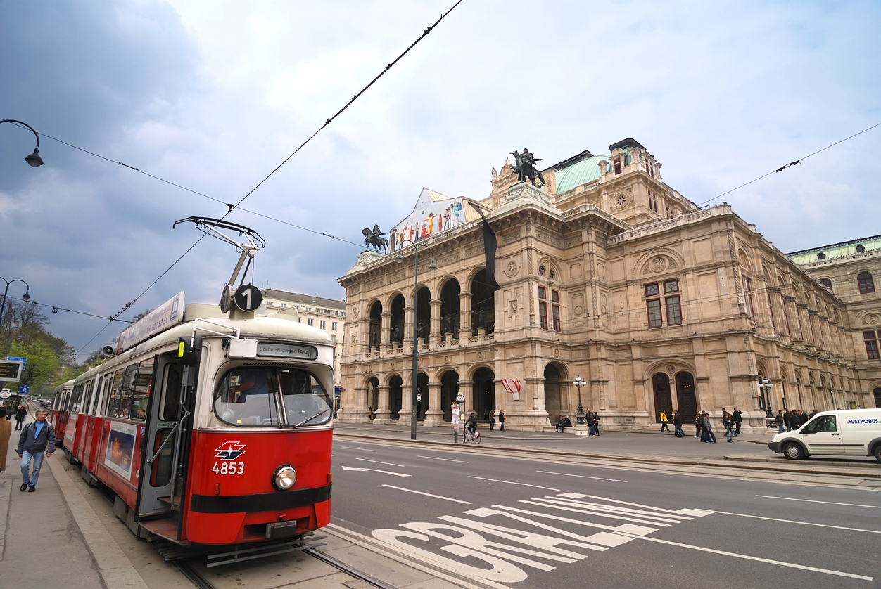 Vienna, Austria - April 14, 2012: Old tram number 1 on tram stop in front of the Opera house in Vienna. Vienna Opera House is situated in the center of Vienna on Opernring. Opernring is part of Ringstrasse which is circular road surrounding central part of Vienna.