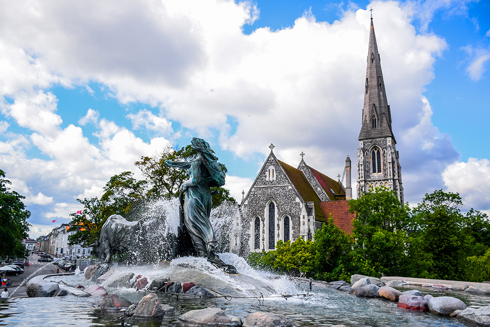 The Gefion Fountain and St. Alban's Church, a large fountain on the harbour front in Copenhagen, Denmark