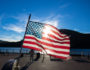 american flag over a lake