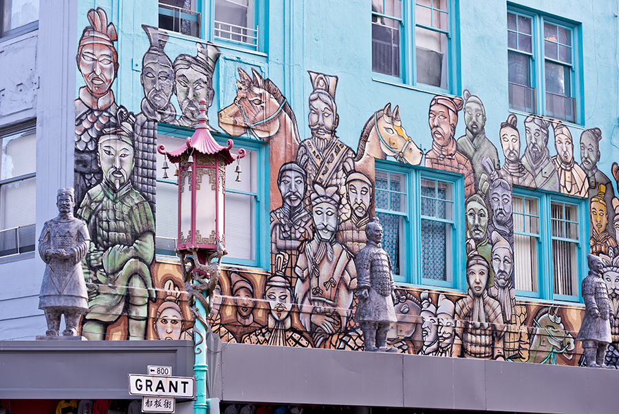 Terracotta Warriors statues and mural on a building on Grant Street in Chinatown in San Francisco.