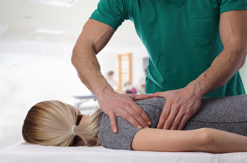 woman getting an adjustment to recover from exercise